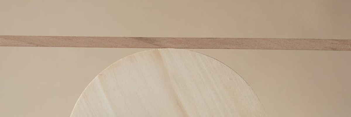 Minimalist geometric composition symbolizing focus and feminine balance